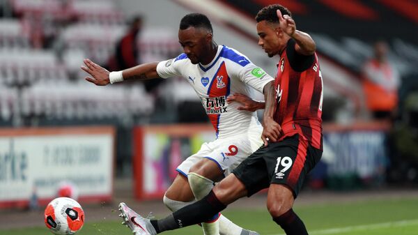 Crystal Palace's French-born Ghanaian striker Jordan Ayew (L) is challenged by Bournemouth's English midfielder Junior Stanislas during the English Premier League football match between Bournemouth and Crystal Palace at the Vitality Stadium in Bournemouth, southern England on June 20, 2020. (Photo by Ian Walton / POOL / AFP) / RESTRICTED TO EDITORIAL USE. No use with unauthorized audio, video, data, fixture lists, club/league logos or 'live' services. Online in-match use limited to 120 images. An additional 40 images may be used in extra time. No video emulation. Social media in-match use limited to 120 images. An additional 40 images may be used in extra time. No use in betting publications, games or single club/league/player publications. / Crystal Palace's French-born Ghanaian striker Jordan Ayew (L) is challenged by Bournemouth's English midfielder Junior Stanislas during the English Premier League football match between Bournemouth and Crystal Palace at the Vitality Stadium in Bournemouth, southern England on June 20, 2020. (Photo by Ian Walton / POOL / AFP) / RESTRICTED TO EDITORIAL USE. No use with unauthorized audio, video, data, fixture lists, club/league logos or 'live' services. Online in-match use limited to 120 images. An additional 40 images may be used in extra time. No video emulation. Social media in-match use limited to 120 images. An additional 40 images may be used in extra time. No use in betting publications, games or single club/league/player publications. /