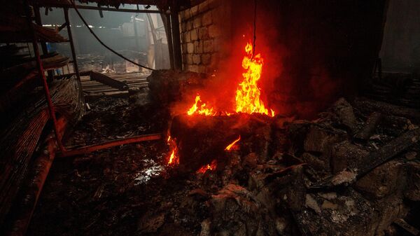 Последствия пожара в магазине строительных материалов, возникшего в результате обстрелов Степанакерта Последствия пожара в магазине строительных материалов, возникшего в результате обстрелов Степанакерта