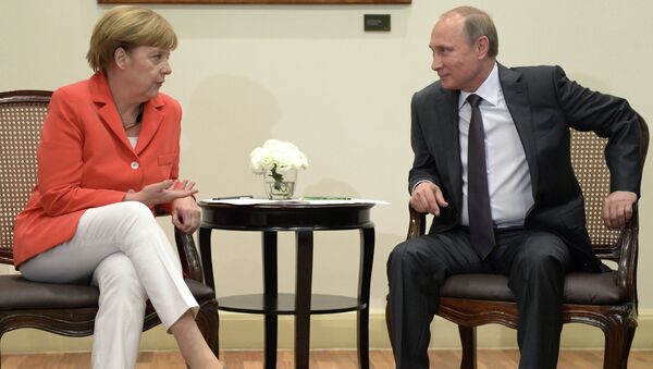 Президент России Владимир Путин и канцлер Германии Ангела Меркель во время встречи в Рио-де-Жанейро Президент России Владимир Путин и канцлер Германии Ангела Меркель во время встречи в Рио-де-Жанейро