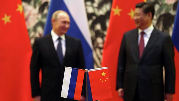 Президент России Владимир Путин и председатель КНР Си Цзиньпин. Архивное фото Президент России Владимир Путин и председатель КНР Си Цзиньпин. Архивное фото