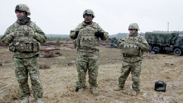 Военнослужащие блока НАТО принимают участие в военных учениях в Латвии. Архивное фото Военнослужащие блока НАТО принимают участие в военных учениях в Латвии. Архивное фото