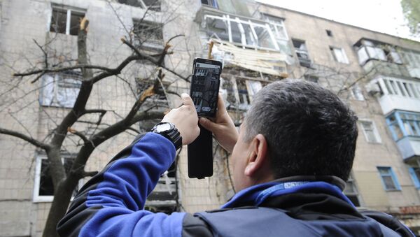 Последствия обстрелов в Донецке Последствия обстрелов в Донецке
