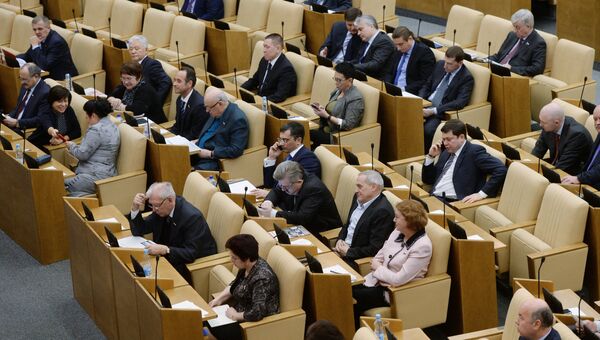 Депутаты на пленарном заседании Государственной Думы РФ. Архивное фото Депутаты на пленарном заседании Государственной Думы РФ. Архивное фото