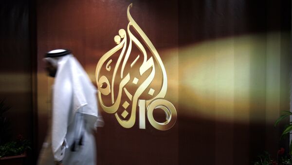 Сотрудник в офисе телекомпании Al Jazeera в Дохе, Катар. Архивное фото Сотрудник в офисе телекомпании Al Jazeera в Дохе, Катар. Архивное фото