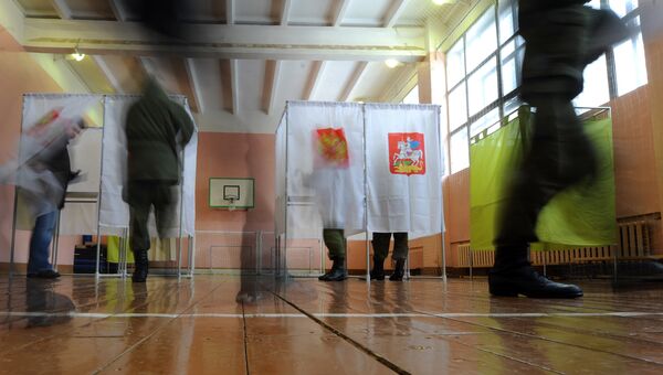 Голосование во время выборов президента РФ в Московской области. Архивное фото Голосование во время выборов президента РФ в Московской области. Архивное фото