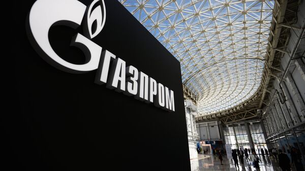 Стенд с логотипом компании Газпром. Архивное фото Стенд с логотипом компании Газпром. Архивное фото