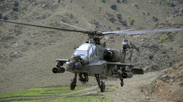 Американский вертолет AH-64 Apache. Архивное фото Американский вертолет AH-64 Apache. Архивное фото