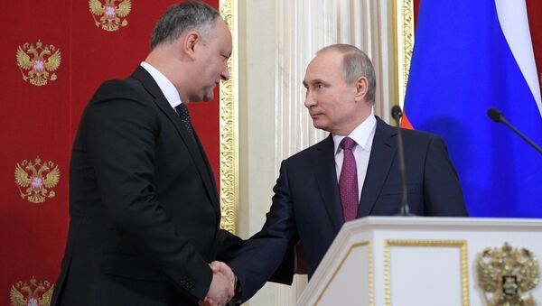 Президент РФ Владимир Путин и президент Молдовы Игорь Додон. Архивное фото Президент РФ Владимир Путин и президент Молдовы Игорь Додон. Архивное фото