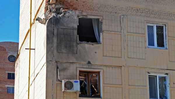 Жилое здание на улице Листопрокатчиков в Киевском районе Донецка, пострадавшее от обстрела Жилое здание на улице Листопрокатчиков в Киевском районе Донецка, пострадавшее от обстрела