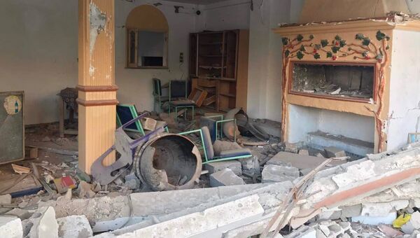Разрушенный в результате боевых действий дом в жилой части города Пальмира в сирийской провинции Хомс Разрушенный в результате боевых действий дом в жилой части города Пальмира в сирийской провинции Хомс