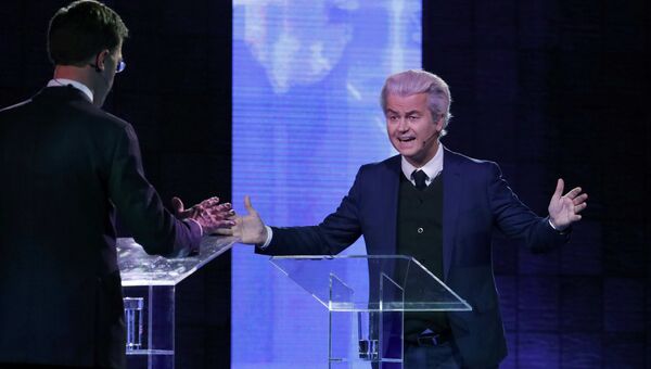 Премьер-министр Нидерландов Марк Рютте и лидер ультраправой Партии свободы Герт Вилдерс во время дебатов Премьер-министр Нидерландов Марк Рютте и лидер ультраправой Партии свободы Герт Вилдерс во время дебатов