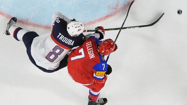 Игрок сборной России Иван Телегин и игрок сборной США Джейкоб Троуба в матче между сборными командами России и США Игрок сборной России Иван Телегин и игрок сборной США Джейкоб Троуба в матче между сборными командами России и США