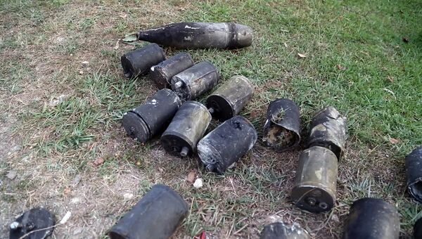 Останки боеприпасов на месте взрыва склада Минобороны Абхазии в селе Приморское Останки боеприпасов на месте взрыва склада Минобороны Абхазии в селе Приморское