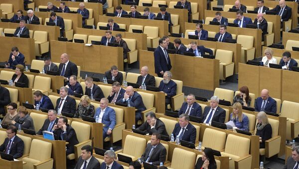 Депутаты на пленарном заседании Государственной Думы РФ. Архивное фото Депутаты на пленарном заседании Государственной Думы РФ. Архивное фото