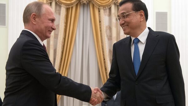 Президент РФ Владимир Путин и премьер Государственного совета Китайской Народной Республики Ли Кэцян. Архивное фото Президент РФ Владимир Путин и премьер Государственного совета Китайской Народной Республики Ли Кэцян. Архивное фото
