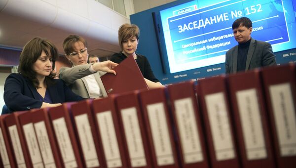 В информационном центре ЦИК перед оглашением итогов голосования на выборах президента РФ. Архивное фото В информационном центре ЦИК перед оглашением итогов голосования на выборах президента РФ. Архивное фото