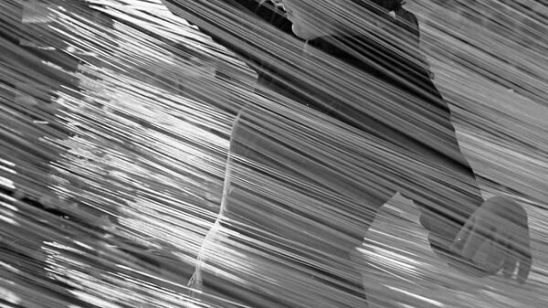 Работница комбината искусственного синтетического волокна за работой в ткацком цехе Работница комбината искусственного синтетического волокна за работой в ткацком цехе