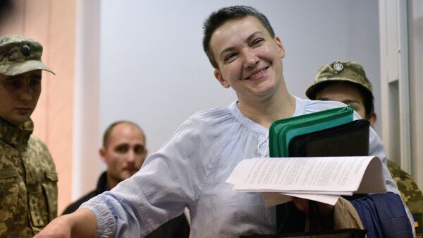 Надежда Савченко во время рассмотрения вопроса о продлении срока её ареста на заседании Шевченковского районного суда в Киеве. 14 мая 2018 Надежда Савченко во время рассмотрения вопроса о продлении срока её ареста на заседании Шевченковского районного суда в Киеве. 14 мая 2018