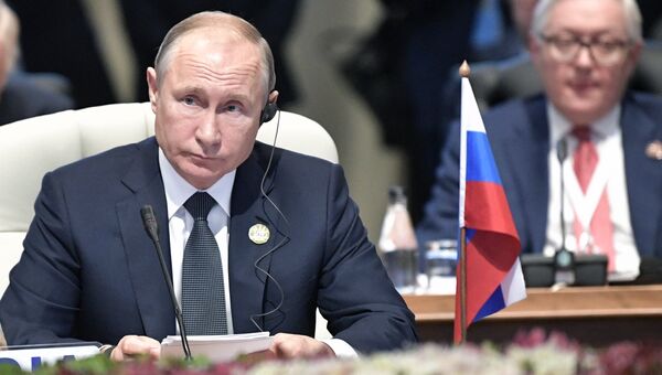 Президент РФ Владимир Путин во время встречи лидеров БРИКС. 26 июля 2018 Президент РФ Владимир Путин во время встречи лидеров БРИКС. 26 июля 2018