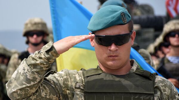 Военнослужащий армии Украины на открытии международных военных учений под эгидой НАТО в Грузии Военнослужащий армии Украины на открытии международных военных учений под эгидой НАТО в Грузии