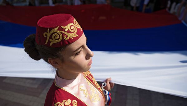 Участница праздничных мероприятий, приуроченных к Дню Государственного флага Российской Федерации в Симферополе Участница праздничных мероприятий, приуроченных к Дню Государственного флага Российской Федерации в Симферополе
