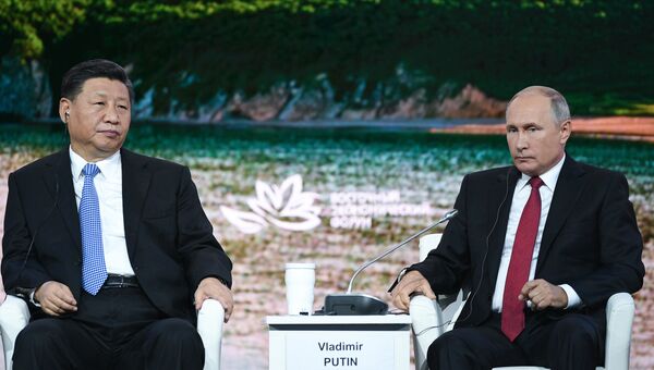 Президент РФ Владимир Путин и председатель Китайской Народной Республики Си Цзиньпин на пленарном заседании Дальний Восток: расширяя границы возможностей IV Восточного экономического форума, архивное фото Президент РФ Владимир Путин и председатель Китайской Народной Республики Си Цзиньпин на пленарном заседании Дальний Восток: расширяя границы возможностей IV Восточного экономического форума, архивное фото