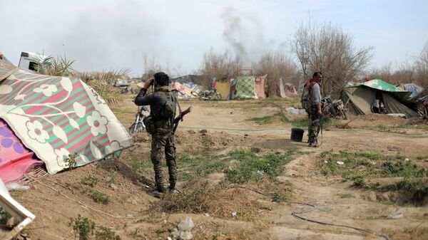 Бойцы Сирийских демократических сил (SDF) в деревне Багуз, провинция Дейр-эль-Зор, Сирия. 10 марта 2019