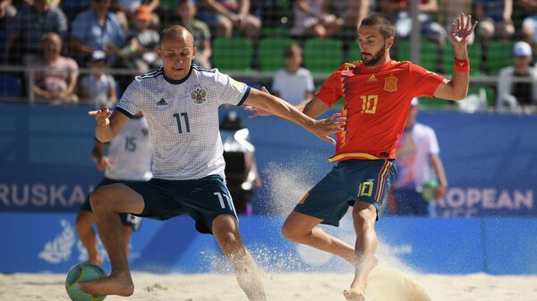 Игровой момент в матче между сборными командами Испании и России