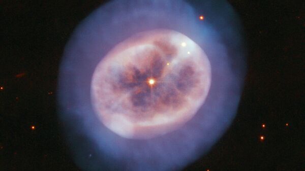 Фотография планетарной туманности NGC 2022 в созвездии Ориона Фотография планетарной туманности NGC 2022 в созвездии Ориона