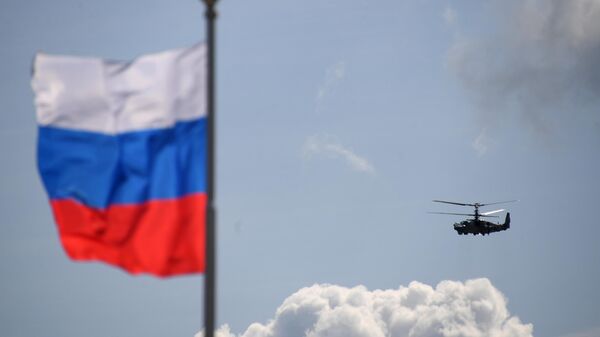 Российский разведывательно-ударный вертолёт Ка-52 Аллигатор выполняет демонстрационный полет на Международном авиационно-космическом салоне МАКС-2019 в подмосковном Жуковском Российский разведывательно-ударный вертолёт Ка-52 Аллигатор выполняет демонстрационный полет на Международном авиационно-космическом салоне МАКС-2019 в подмосковном Жуковском
