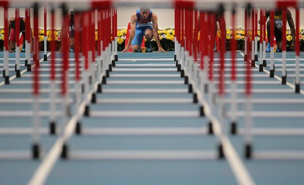 Российский спортсмен Сергей Шубенков в финальном забеге на 110 м с барьерами среди мужчин Российский спортсмен Сергей Шубенков в финальном забеге на 110 м с барьерами среди мужчин